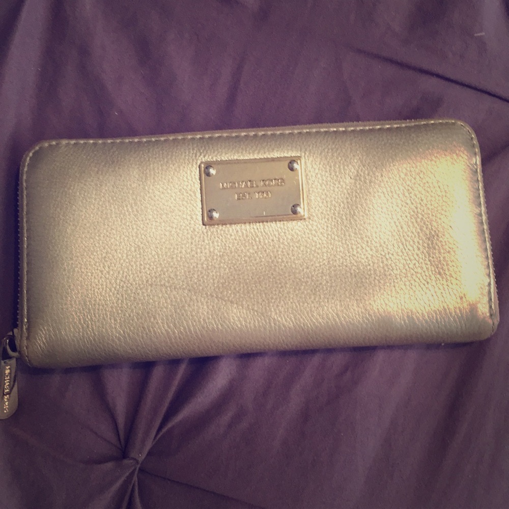 Gold Michael Kors wallet.